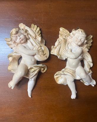 Coppia di angioletti decorativi da parete