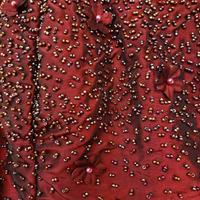 Top da sera con perline e fiori applicati 