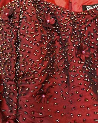 Top da sera con perline e fiori applicati 