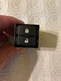 Interruttore apri e chiudi portiere passeggero .