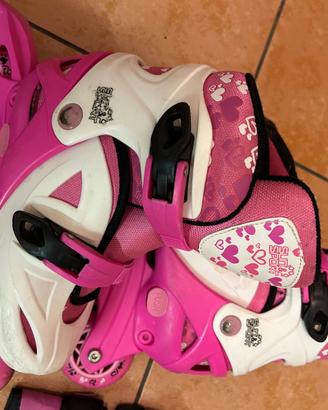Pattini a rotelle rosa n. 31 + casco