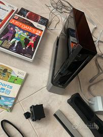 Wii con giochi e manubrio
