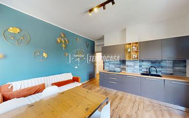 TRILOCALE IN CENTRO CON VISTA APERTA E BOX AUTO