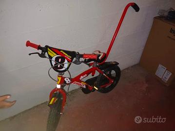 Bicicletta Dino Bikes rossa con manico