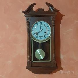 Orologio a pendolo meccanico da parete in legno