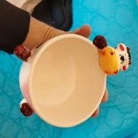 tazza per il latte in porcellana colorata in mucca