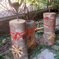 porta candele su tronchetti di legno