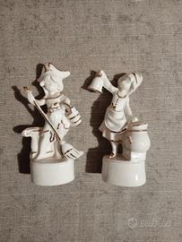 Coppia statuette vintage in ceramica bianca e oro