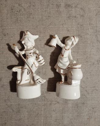 Coppia statuette vintage in ceramica bianca e oro
