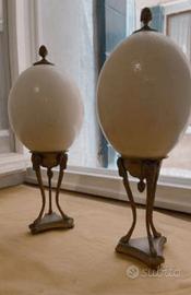 Due uova di struzzo con basamento in bronzo dorato