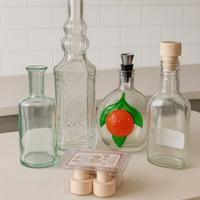 Lotto 4 bottiglie in vetro con Tappi