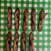 Maniglie cremonesi in ottone bronzato per finestre