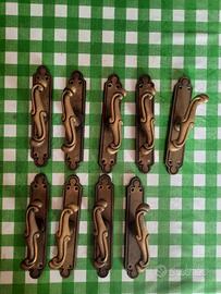 Maniglie cremonesi in ottone bronzato per finestre