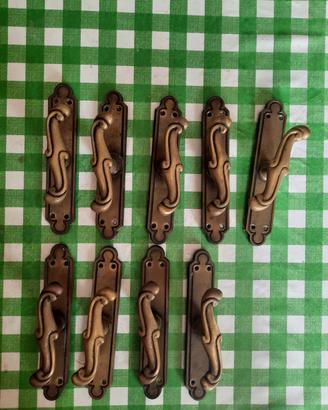 Maniglie cremonesi in ottone bronzato per finestre
