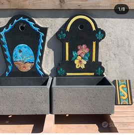 fontane e fioriere in pietra lavica decorati a man