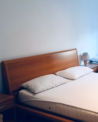 Letto in legno di ciliegio