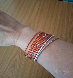 Lotto 12 Bracciali Rigidi Arancioni e Argentati