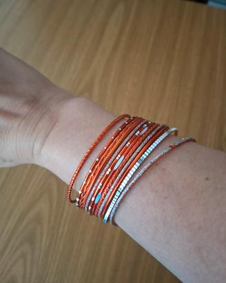 Lotto 12 Bracciali Rigidi Arancioni e Argentati