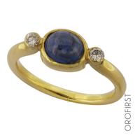 Anello in oro con zaffiro cabochon e diamanti