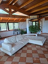 Divano angolare vera pelle con penisola curva