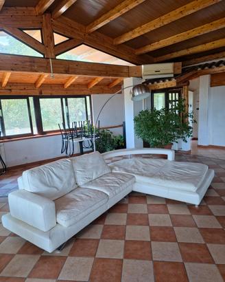 Divano angolare vera pelle con penisola curva