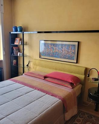 Parete attrezzata sopra letto
