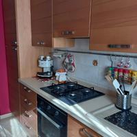 Cucina Scavolini legno con elettrodomestici