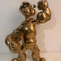 Action figure di braccio di ferro color oro