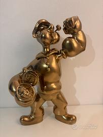 Action figure di braccio di ferro color oro