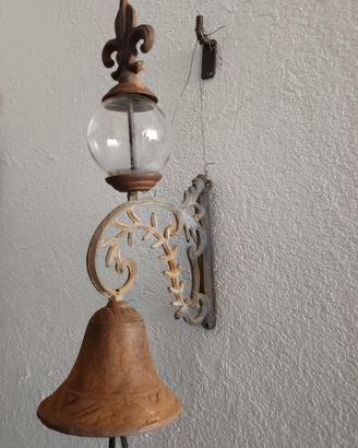 Antica campanella con ampolla in vetro.