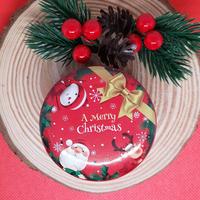 Candela natalizia profumata in contenitore