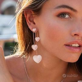 APM MONACO ASYMMETRIC PINK NACRE HEART EARRINGS