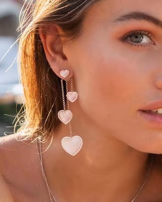 APM MONACO ASYMMETRIC PINK NACRE HEART EARRINGS