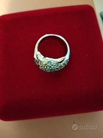 Set anello delfino e bracciale con pietre azzurre