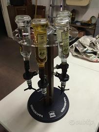 Espositore girevole con dosatore grappe