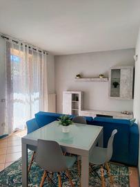 Bilocale arredato con giardino, box  e cantina 