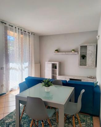 Bilocale arredato con giardino, box  e cantina 