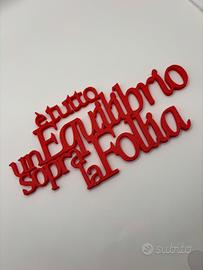 Scritta 3D È tutto un equilibrio sopra la follia