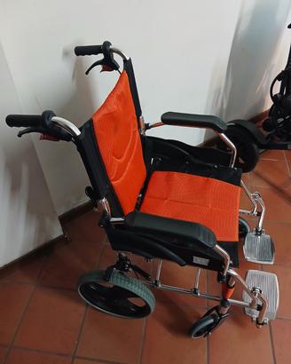 Carozzina per persona con disabilitá