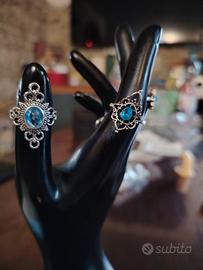 9 anelli con pietre blu