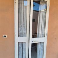Porta in alluminio con vetro