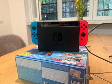 Nintendo Switch + Mario Kart 8 Deluxe + Wii Sport