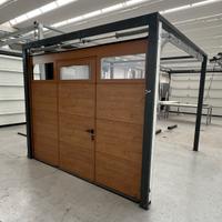 Portone sezionale finto legno con porta 2500xH2050