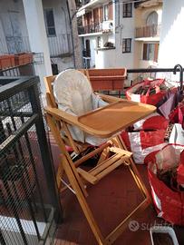 seggiolone in legno con imbottitura e cintura