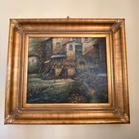 Tela centro storico con cornice in legno dorato