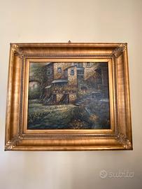 Tela centro storico con cornice in legno dorato