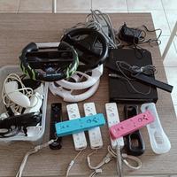 Wii nera con telecomando e volanti