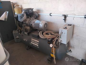 Compressore a pistoni