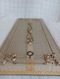 copricalorifero in metallo color oro