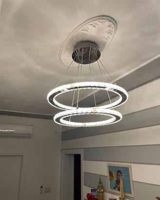 Lampadario acciaio led luce calda